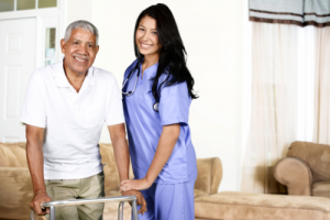 nurse assisting an elderly man