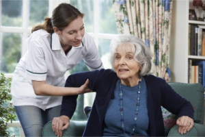 elder assisted by a caregiver